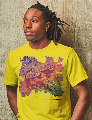 Man weaaring a yellow tshirt depicting a map of Birmingham and the Bullring bull
